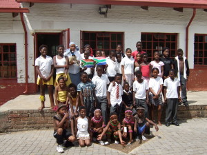 Some students of Belle Primary School with Susu, the emu